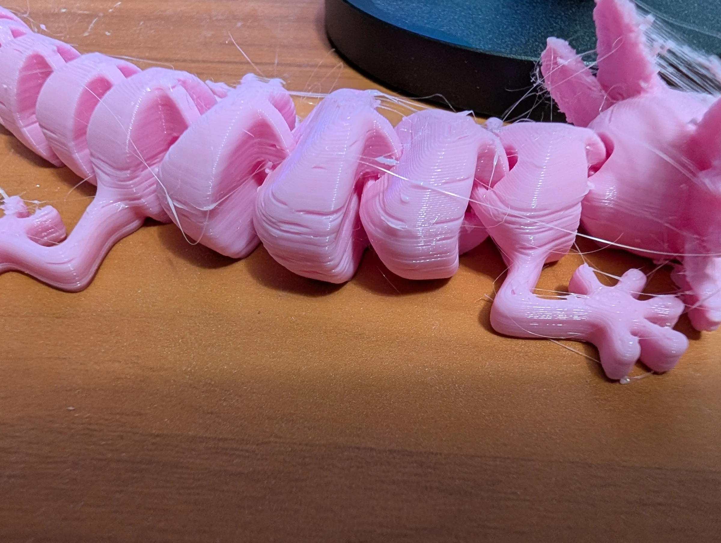 Trying to print a pink axolotl for a neighbor and ended up debugging what's going on here - 3d printing is easy when it works until you have to debug 😂 Otherwise good day, positive team retro at work, Chick-fil-A, and small group.